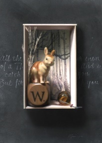 A small wooden box with a rabbit on topDescription automatically generated