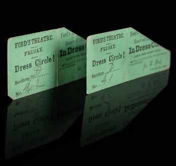 A pair of green tickets