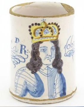 A ceramic cup with an image of King Charles II