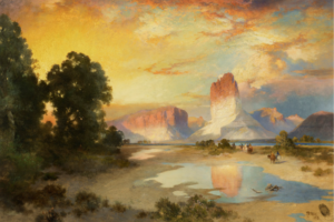 A landscape from the American West, with red and white rock formations in the distance.