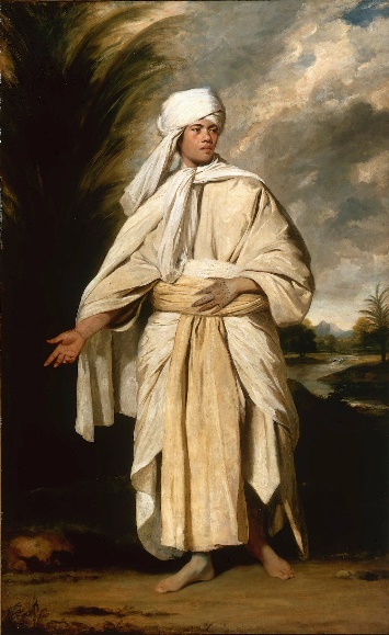 A man in a white outfit with a turbin