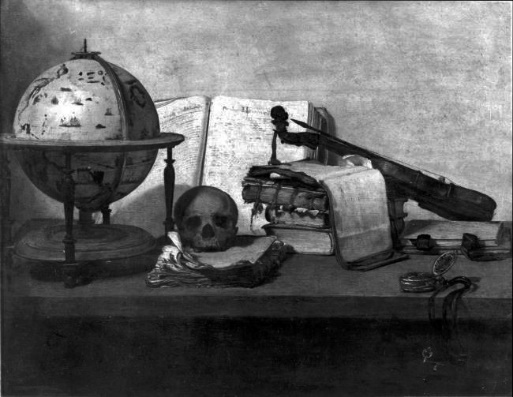 A skull and books on a tableDescription automatically generated